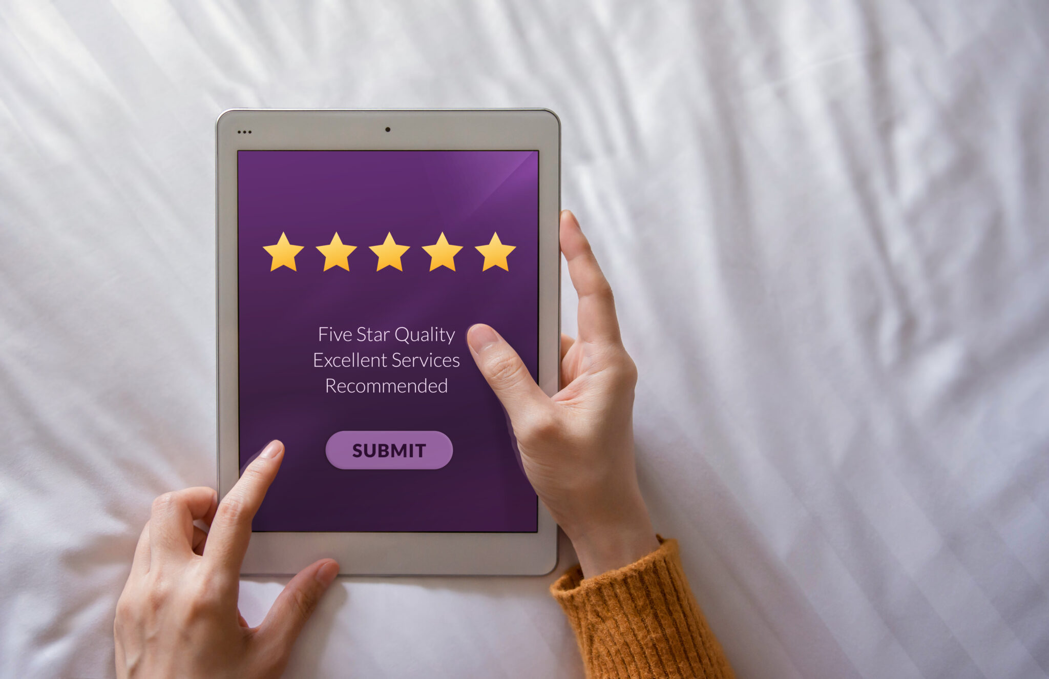 Customer Experience Concept. Happy Client Using Tablet on Bed to